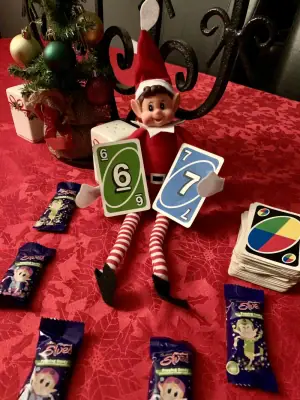 Elf finds cards 6 & 7 in UNO Pack