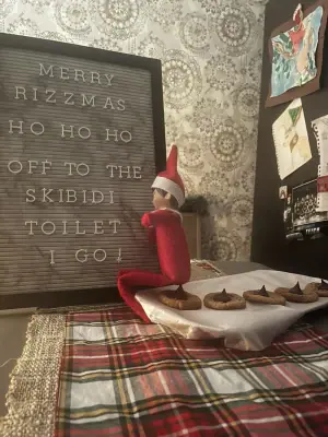 Elf heads off to the Skibidi Toilet after a Rizzmas cookie feast