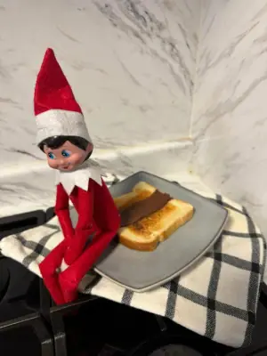 Elf leaves a surprise “poop” on toast