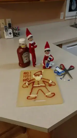 Elves create Santa artwork with tomato ketchup and squirty cream