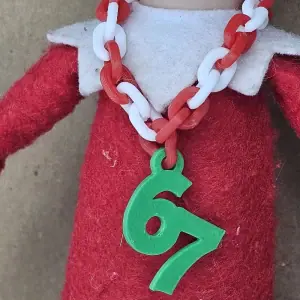 Elf wears 6/7 neck chain