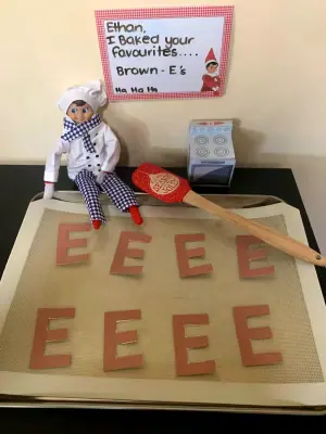 Elf bakes brown E's (brownies) as a treat