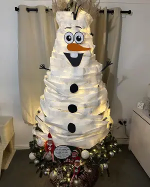 Elves turn Christmas tree into snowman with toilet paper